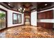 Living room boasts unique flooring, natural light, and custom built-ins at 1800 Melfi Ct, Henderson, NV 89012