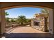 Outdoor patio featuring stone fireplace and decorative wrought iron railing at 1800 Melfi Ct, Henderson, NV 89012
