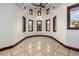 Sitting room boasts a tray ceiling, recessed lights, and marble tiled floor at 1800 Melfi Ct, Henderson, NV 89012