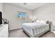 Bright bedroom featuring neutral paint, carpet, and a window providing ample natural light at 4333 Glossier Ave, North Las Vegas, NV 89084