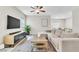 Spacious living area with neutral tones, ceiling fan and ample space for entertaining guests at 4333 Glossier Ave, North Las Vegas, NV 89084