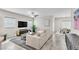 Bright living room with modern decor, neutral tones, and ample natural light at 4333 Glossier Ave, North Las Vegas, NV 89084