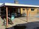 Spacious covered patio area with a view to a backyard pool at 5157 New Bedford Dr, Las Vegas, NV 89122
