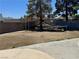 Expansive backyard with mature trees and trampoline, perfect for Gathering activities at 5157 New Bedford Dr, Las Vegas, NV 89122