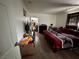 Bedroom with wood-look flooring, closet, and a view into another room at 5157 New Bedford Dr, Las Vegas, NV 89122