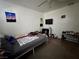 Modest bedroom featuring a ceiling fan and dark brown carpeting at 5157 New Bedford Dr, Las Vegas, NV 89122
