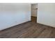 Bedroom featuring wood-look floors and a closet with custom shelving at 5157 New Bedford Dr, Las Vegas, NV 89122