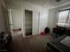 This secondary bedroom includes a large closet and view of the home's exterior at 5157 New Bedford Dr, Las Vegas, NV 89122