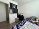 Bedroom featuring a twin bed, television, and Raiders decor at 5157 New Bedford Dr, Las Vegas, NV 89122