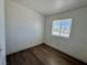 This cozy bedroom offers great natural light and wood-look flooring at 5157 New Bedford Dr, Las Vegas, NV 89122