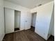 This bedroom is equipped with a large closet and wood-look floors at 5157 New Bedford Dr, Las Vegas, NV 89122