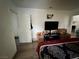 View of bedroom featuring hard surface floors, television, and closet at 5157 New Bedford Dr, Las Vegas, NV 89122
