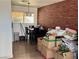 Bright dining area with brick accent wall and a large window at 5157 New Bedford Dr, Las Vegas, NV 89122