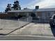 Charming single-story home featuring a white fence and a well-maintained front yard at 5157 New Bedford Dr, Las Vegas, NV 89122