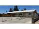 Charming single-story home with a gated front yard and mature trees at 5157 New Bedford Dr, Las Vegas, NV 89122