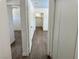 Hallway featuring wood-look flooring with connecting rooms and closet space at 5157 New Bedford Dr, Las Vegas, NV 89122