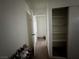 Hallway features closet with shelving and a view to another room at 5157 New Bedford Dr, Las Vegas, NV 89122
