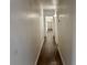 Long hallway features hardwood floors and leads to bedroom and closets at 5157 New Bedford Dr, Las Vegas, NV 89122