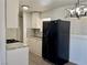 Well-equipped kitchen with stone backsplash, granite countertops, and modern appliances at 5157 New Bedford Dr, Las Vegas, NV 89122