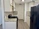 Well-equipped kitchen with stone backsplash, granite countertops, and modern appliances at 5157 New Bedford Dr, Las Vegas, NV 89122