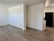 Spacious living room featuring wood-look floors and a bright atmosphere at 5157 New Bedford Dr, Las Vegas, NV 89122