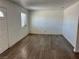 Open living room with wood-look floors and a front entry door at 5157 New Bedford Dr, Las Vegas, NV 89122