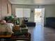 Cozy room featuring natural light from the door and window, plus a striking brick wall accent at 5157 New Bedford Dr, Las Vegas, NV 89122