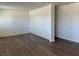 An open-concept living space with fresh paint and new laminate wood flooring at 5157 New Bedford Dr, Las Vegas, NV 89122
