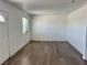 Open living room with wood-look floors and a bright atmosphere at 5157 New Bedford Dr, Las Vegas, NV 89122