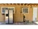 Outdoor patio features a stainless-steel refrigerator and a convenient door for easy access to the house at 5157 New Bedford Dr, Las Vegas, NV 89122