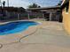 This pool has a fence around it, providing a safe and enjoyable outdoor space at 5157 New Bedford Dr, Las Vegas, NV 89122