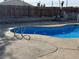 Beautiful backyard pool with surrounding patio, perfect for outdoor relaxation and entertaining at 5157 New Bedford Dr, Las Vegas, NV 89122