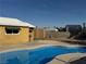 Backyard pool with a view of a shed and the house at 5157 New Bedford Dr, Las Vegas, NV 89122