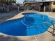 Inviting backyard pool with clear blue water and a pristine deck area at 5157 New Bedford Dr, Las Vegas, NV 89122