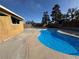 A refreshing pool offers outdoor enjoyment, set in a spacious backyard with ample room for relaxation at 5157 New Bedford Dr, Las Vegas, NV 89122