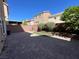 Paved backyard featuring a brick perimeter wall and minimal landscaping at 6020 Arbor Downs Ave, Las Vegas, NV 89139