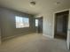 Neutral bedroom features ample natural light and a mirrored closet at 6020 Arbor Downs Ave, Las Vegas, NV 89139