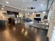 Open-concept living room with hardwood floors, recessed lighting, and plantation shutters at 6020 Arbor Downs Ave, Las Vegas, NV 89139