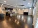 Spacious open-concept living room with hardwood floors, recessed lighting, and ceiling fan at 6020 Arbor Downs Ave, Las Vegas, NV 89139