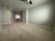 Expansive carpeted loft area offers versatile living space with overhead lighting at 6020 Arbor Downs Ave, Las Vegas, NV 89139