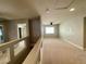Spacious carpeted loft area with a ceiling fan and ample natural light at 6020 Arbor Downs Ave, Las Vegas, NV 89139