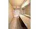Bathroom featuring dark wood cabinets and granite countertops with a shower and tub combo at 8101 W Flamingo Rd # 1044, Las Vegas, NV 89147