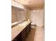Clean bathroom featuring dark wood cabinets and granite countertops with a shower and tub combo at 8101 W Flamingo Rd # 1044, Las Vegas, NV 89147