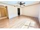 Bedroom with ceiling fan, wood floors, and natural light through the windows at 8101 W Flamingo Rd # 1044, Las Vegas, NV 89147