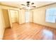 Bright bedroom with a ceiling fan, closet, and wood-look floors for a modern aesthetic at 8101 W Flamingo Rd # 1044, Las Vegas, NV 89147