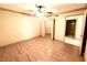 Spacious bedroom with a ceiling fan, wood flooring, and a walk-in closet at 8101 W Flamingo Rd # 1044, Las Vegas, NV 89147