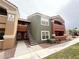 Condo building with multiple units, a stairway, and desert landscaping around the complex at 8101 W Flamingo Rd # 1044, Las Vegas, NV 89147