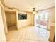 Inviting living room with a ceiling fan and sliding glass doors to a balcony at 8101 W Flamingo Rd # 1044, Las Vegas, NV 89147