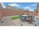 Private backyard with brick patio and artificial turf, ideal for outdoor living at 8919 Don Valley Ave, Las Vegas, NV 89148