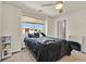 Comfortable bedroom with a window view, plush carpet, and ample natural light at 8919 Don Valley Ave, Las Vegas, NV 89148